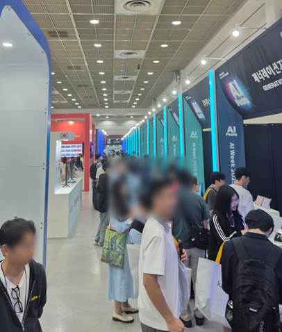 People viewing the booths inside the exhibition hall