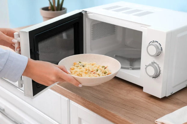 taking out warm food from a microwave