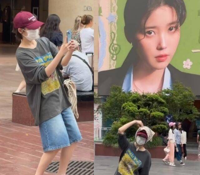 아이유, 상하이 깜짝 등장 자신의 대형 광고판 앞에서 기념사진